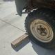 To keep your car from rolling, throw a block of wood behind your wheel.